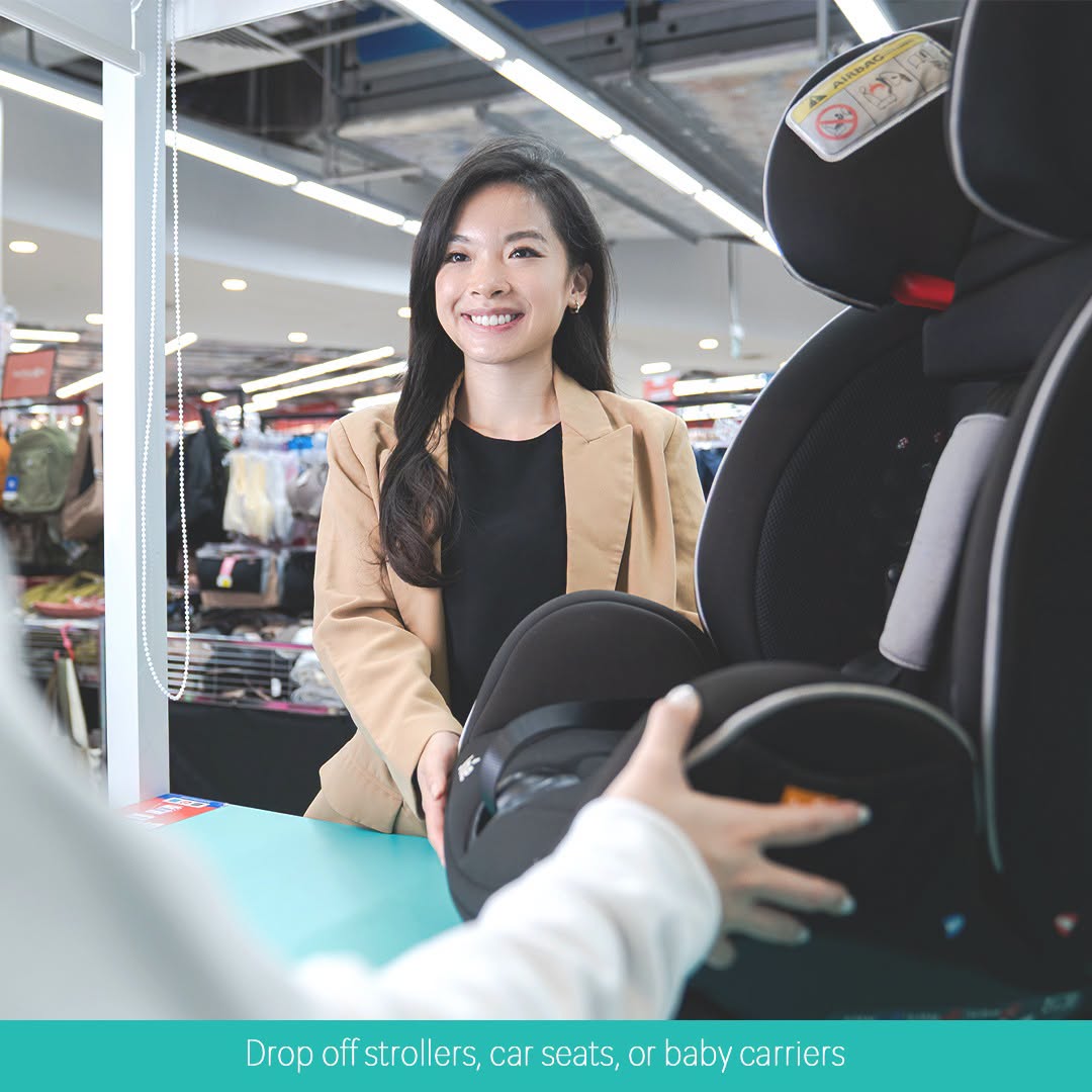 The Care employee demonstrating cleaning service on a child car seat