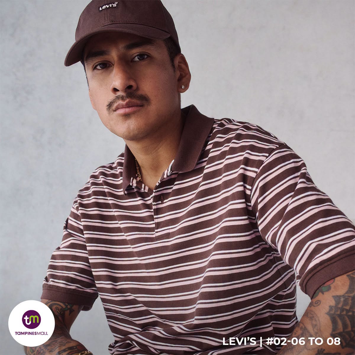 Levi's striped polo shirt and baseball cap