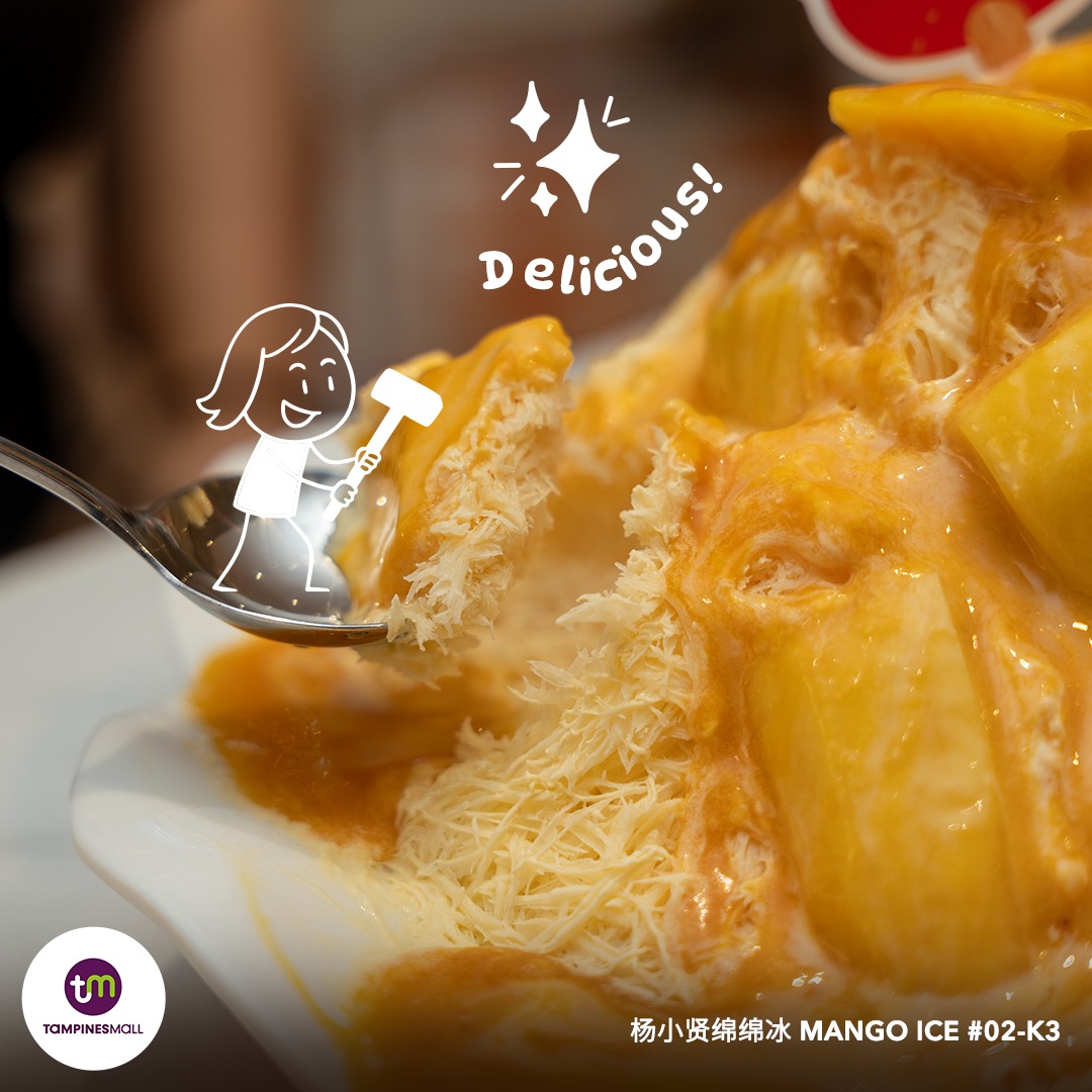 Friends sharing a large mango dessert at Tampines Mall