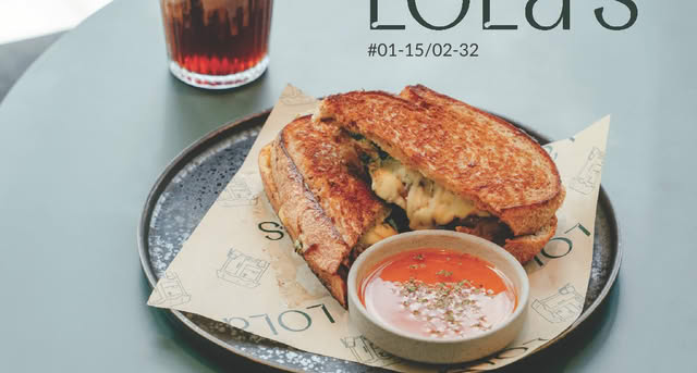 The inviting exterior or a cozy interior view of Lola's Cafe at Tampines Mall.