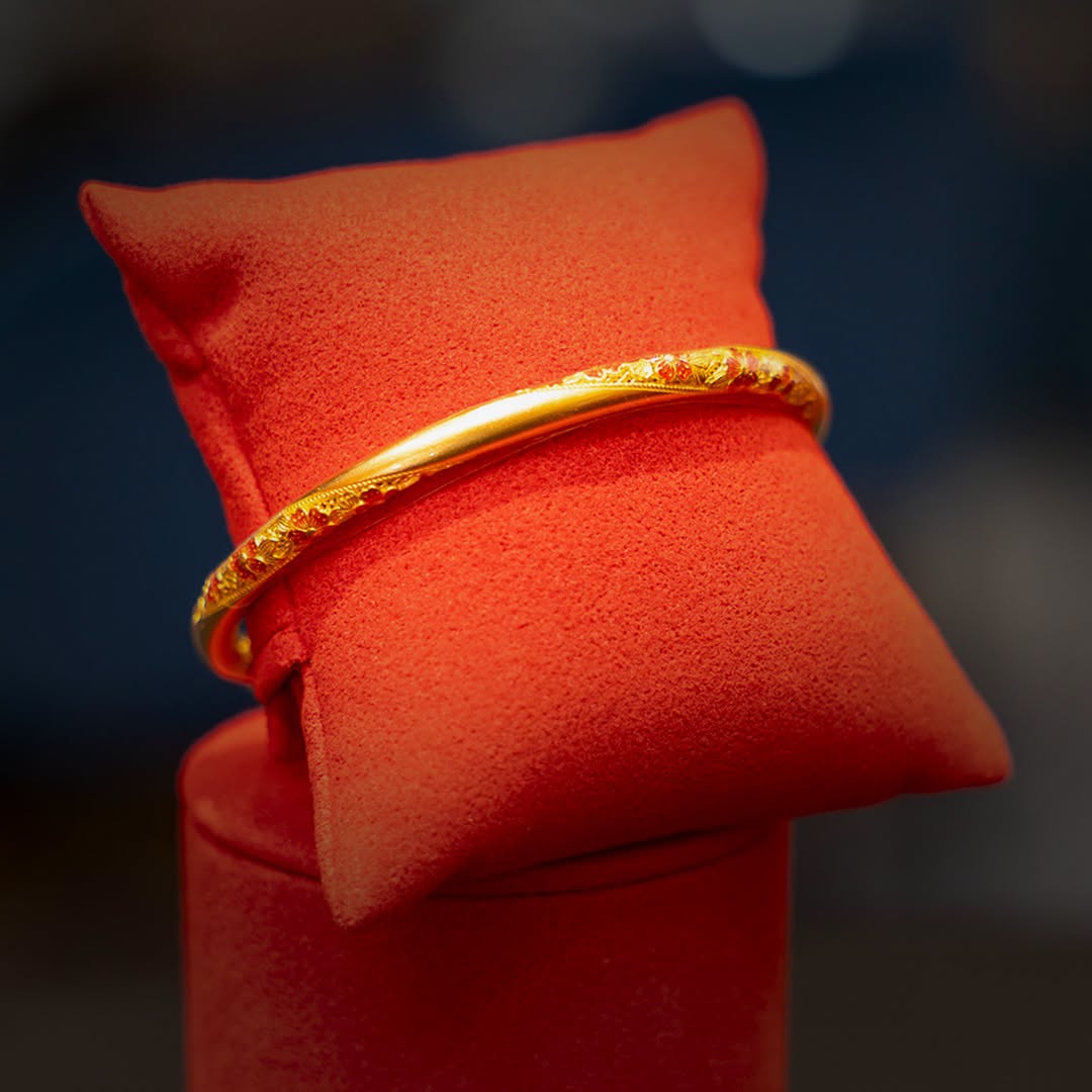 Ornate gold bangle with floral engraving from Lee Hwa Jewellery